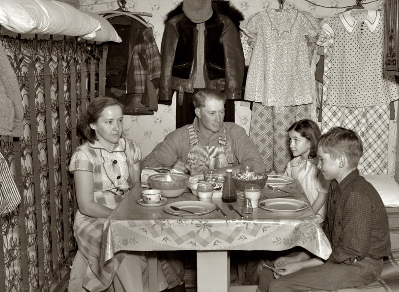 December 1936. "Marcus Miller and family in shack that he built himself. Spencer, Iowa. This is half the house. Miller is a hired hand who has managed to save enough to make a part payment on seven and a half acres of land. However, he is most anxious to get steady work or to operate a farm." View full size. Medium format nitrate negative by Russell Lee for the Farm Security Administration.