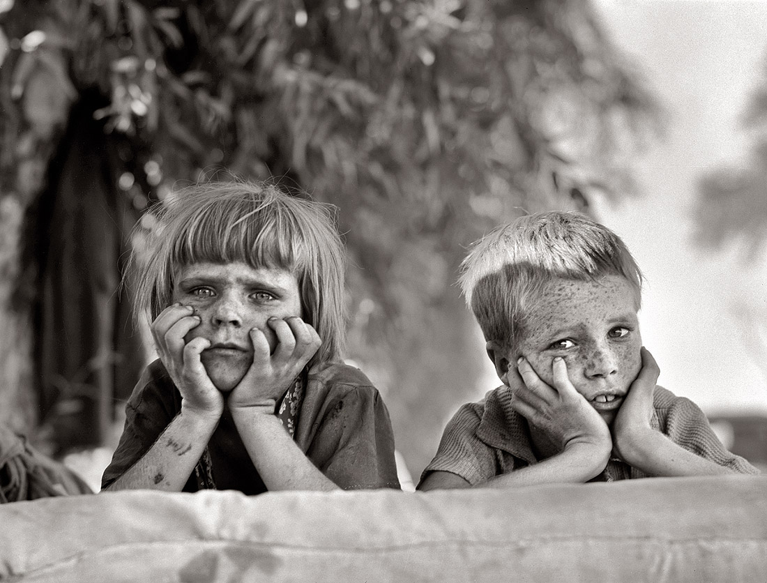 "Children of Oklahoma drought refugee in migratory camp in California." November 1936. View full size. Photograph by Dorothea Lange.