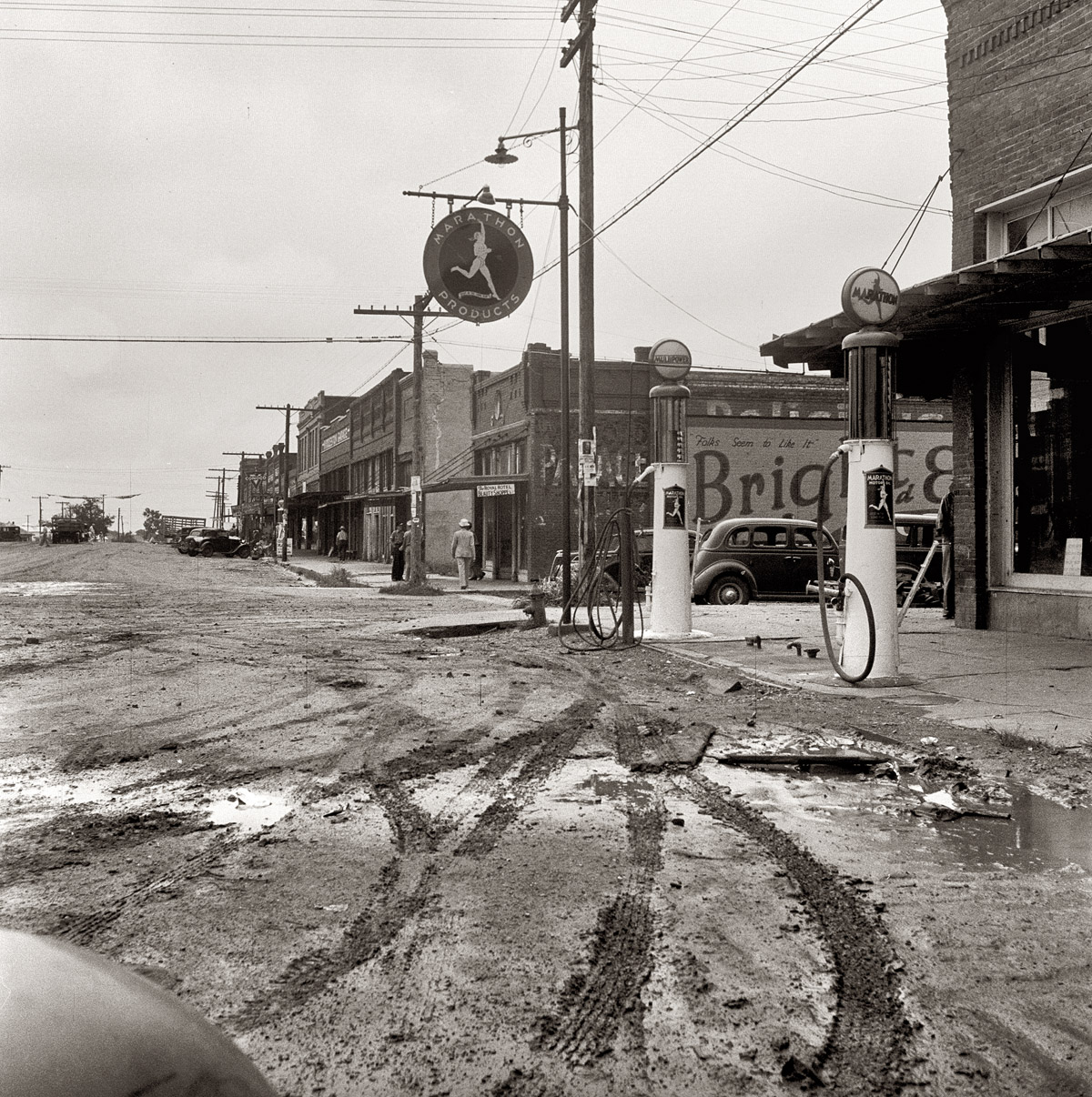 June 1938. Caddo, Oklahoma. Migrants leave the small towns as well as the farms of the southwest. This region is a source of many emigrants to the Pacific Coast. View full size. Photograph by Dorothea Lange.