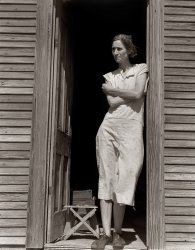 June 1938. Nettie Featherston, laborer's wife with three children near Childress, Texas. "I just prayed and prayed and prayed all the time that God would take care of us and not let my children starve." View full size | Audio interview.