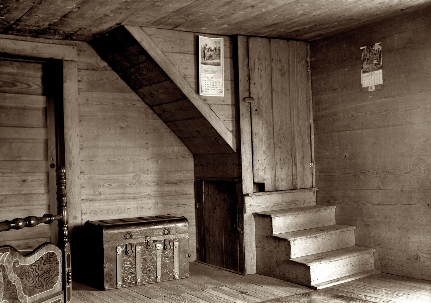 July 1939. "Corner of tobacco farmer's front room. Shows enclosed stairway and corner of the new fancy bed. Person County, North Carolina." (Whitfield home.) Medium-format nitrate negative by Dorothea Lange. View full size.