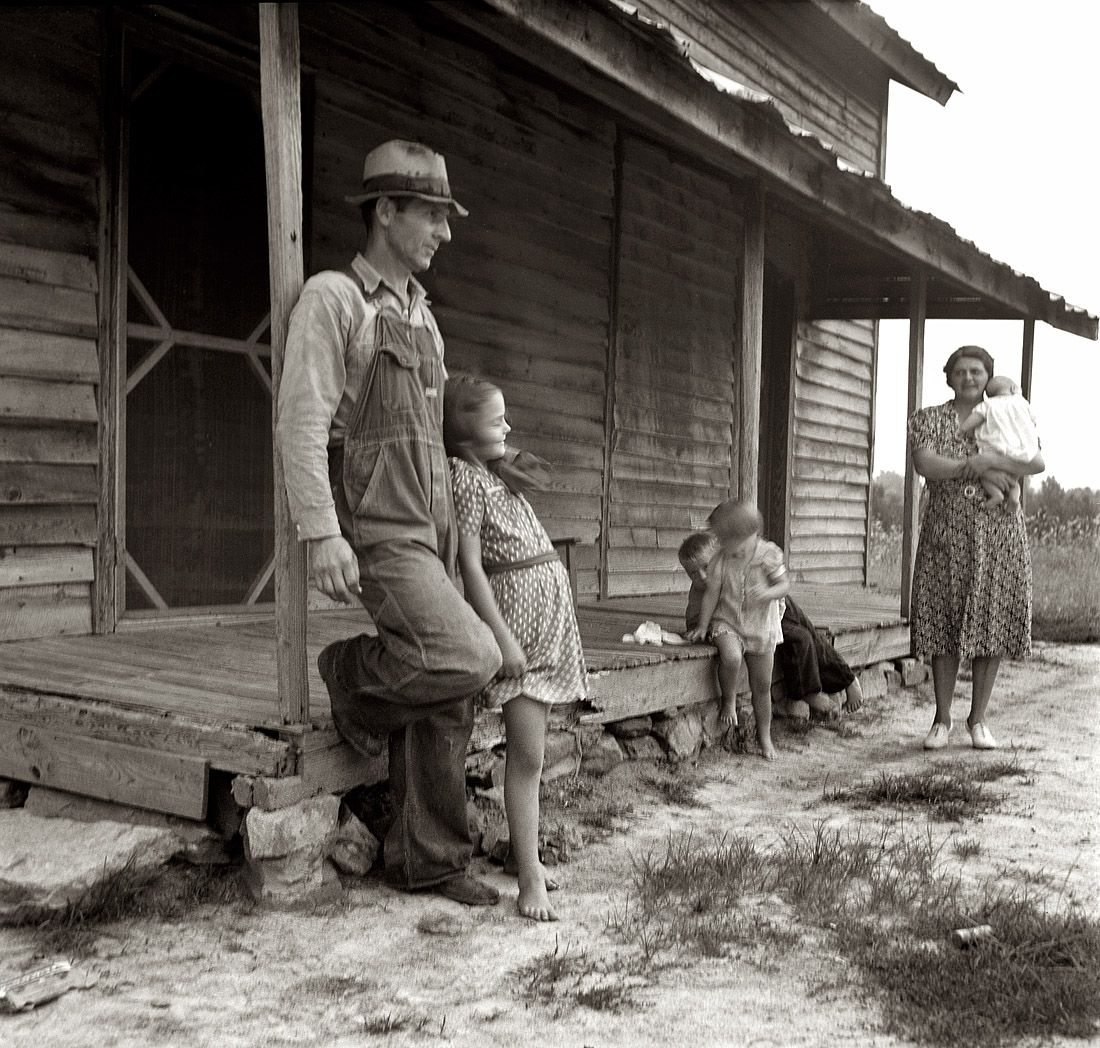 July 1939. "Tobacco sharecropper's house. White family. Rural rehabilitation clients. Whitfield family. Near Gordonton, North Carolina." View full size. 35mm nitrate negative by Dorothea Lange for the Farm Security Administration.
