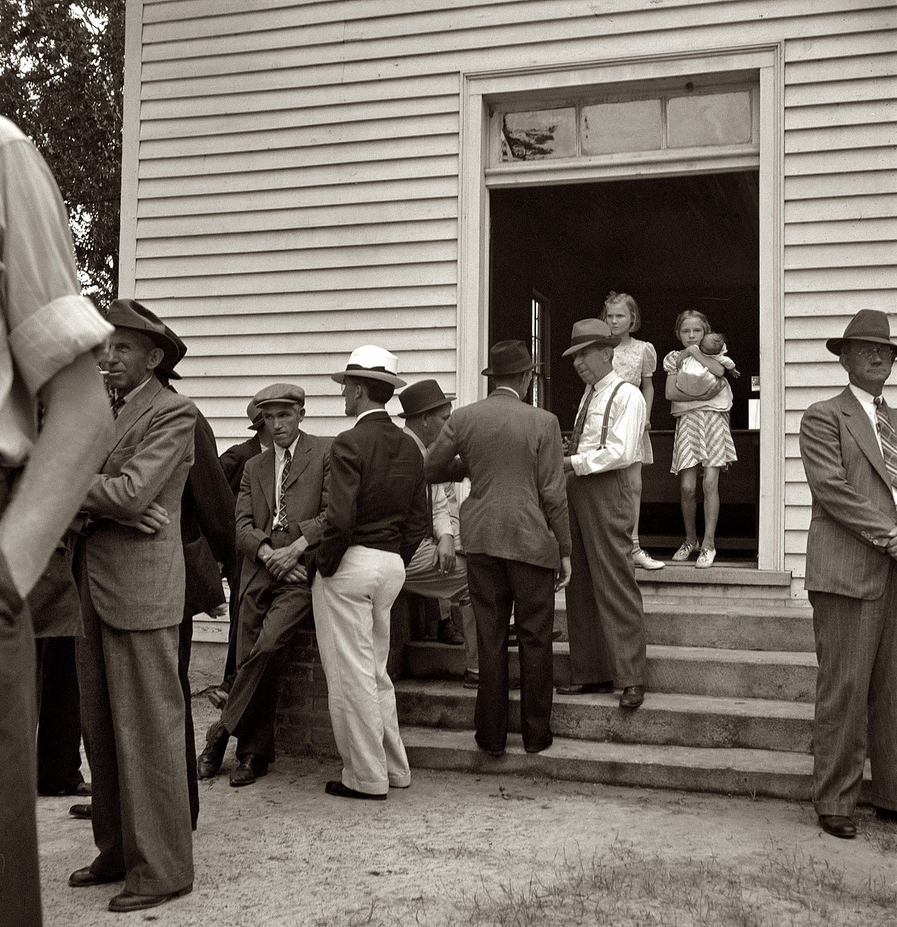 July 1939. "Congregation gathers after services to talk. Wheeley's [Wheeler's?] Church, Person County, North Carolina." View full size. Medium-format nitrate negative by Dorothea Lange for the Farm Security Administration.