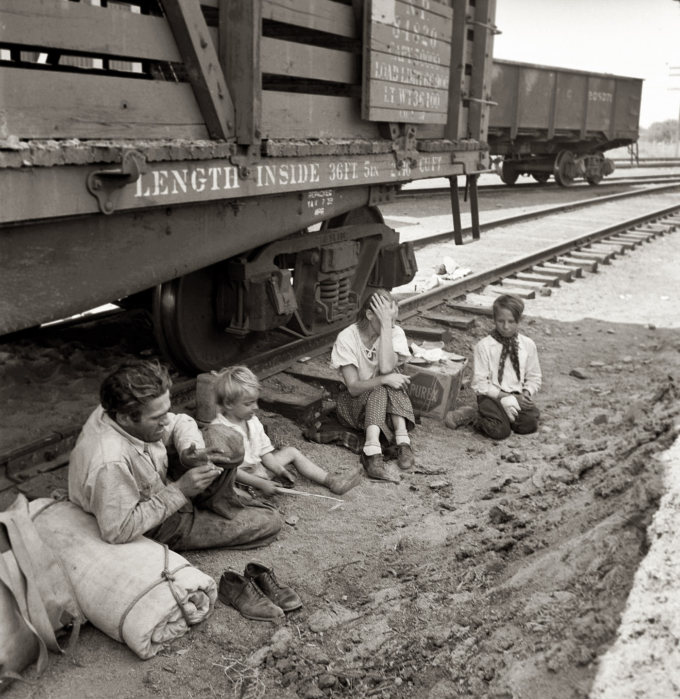 August 1939. Agricultural migrants. "Family who traveled by freight train. Toppenish, Washington. Yakima Valley."  View full size. Medium-format nitrate negative by Dorothea Lange for the Farm Security Administration.