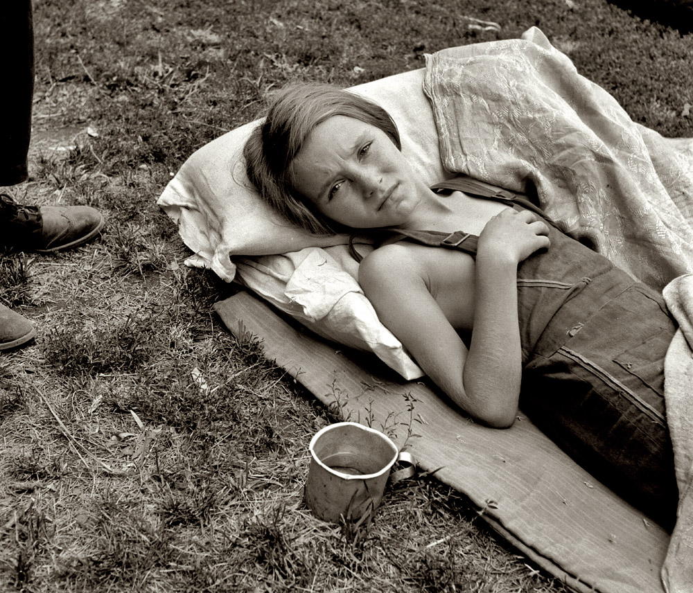 August 1939. "Sick migrant child. Washington, Yakima Valley, Toppenish." The daughter of migrant laborers harvesting hops in Washington State. Medium format nitrate negative by Dorothea Lange for the FSA. View full size.