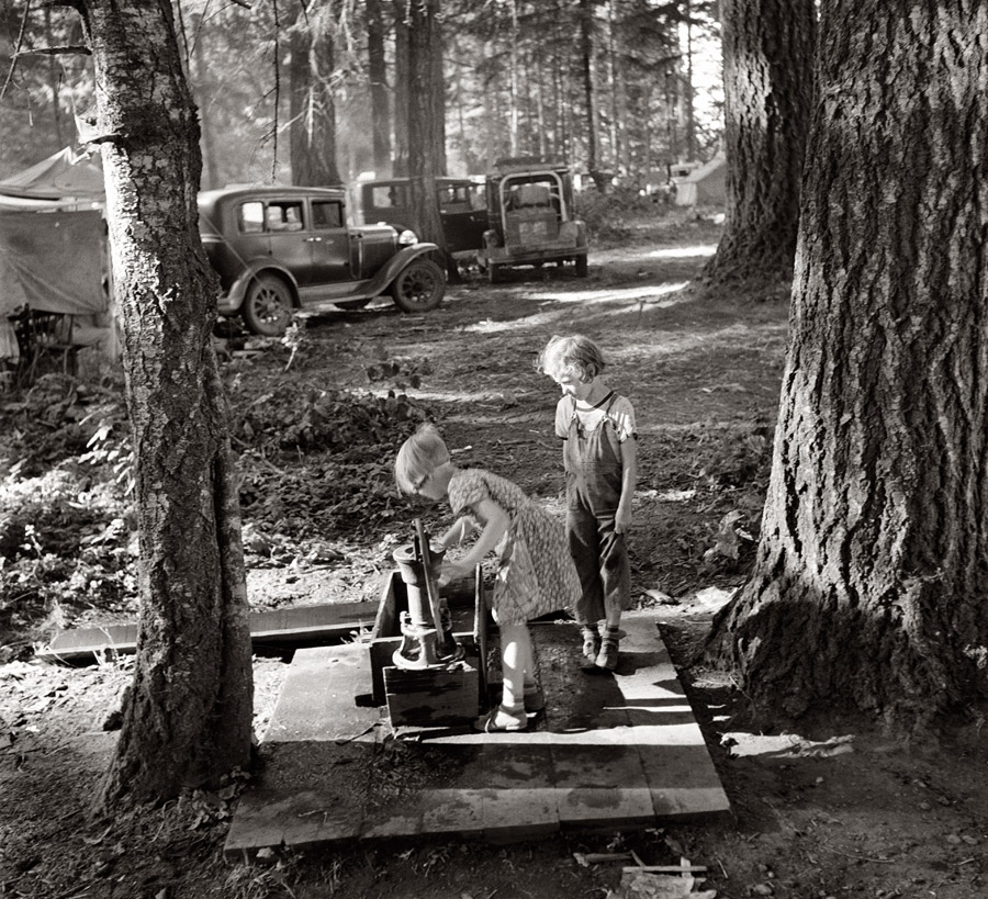 August 1939. Marion County, Oregon, near West Stayton. Children in large private bean pickers' camp. The pickers came from many states, from Oklahoma to North Dakota. View full size. Photograph by Dorothea Lange.