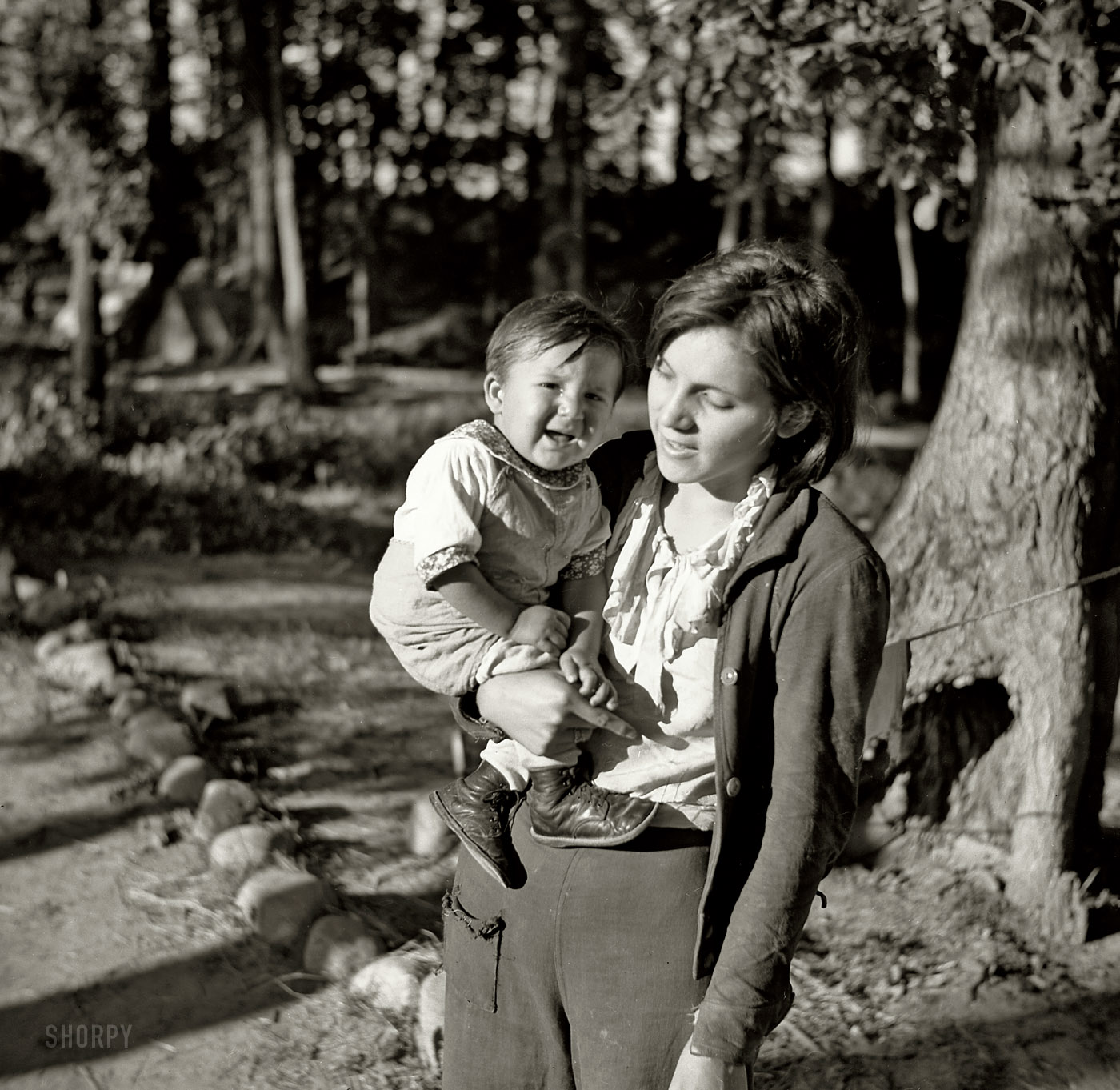 August 1937. "Indian girl and her baby cousin. Blueberry pickers' camp, Littlefork, Minnesota." Medium format nitrate negative by Russell Lee for the Resettlement Administration. View full size.