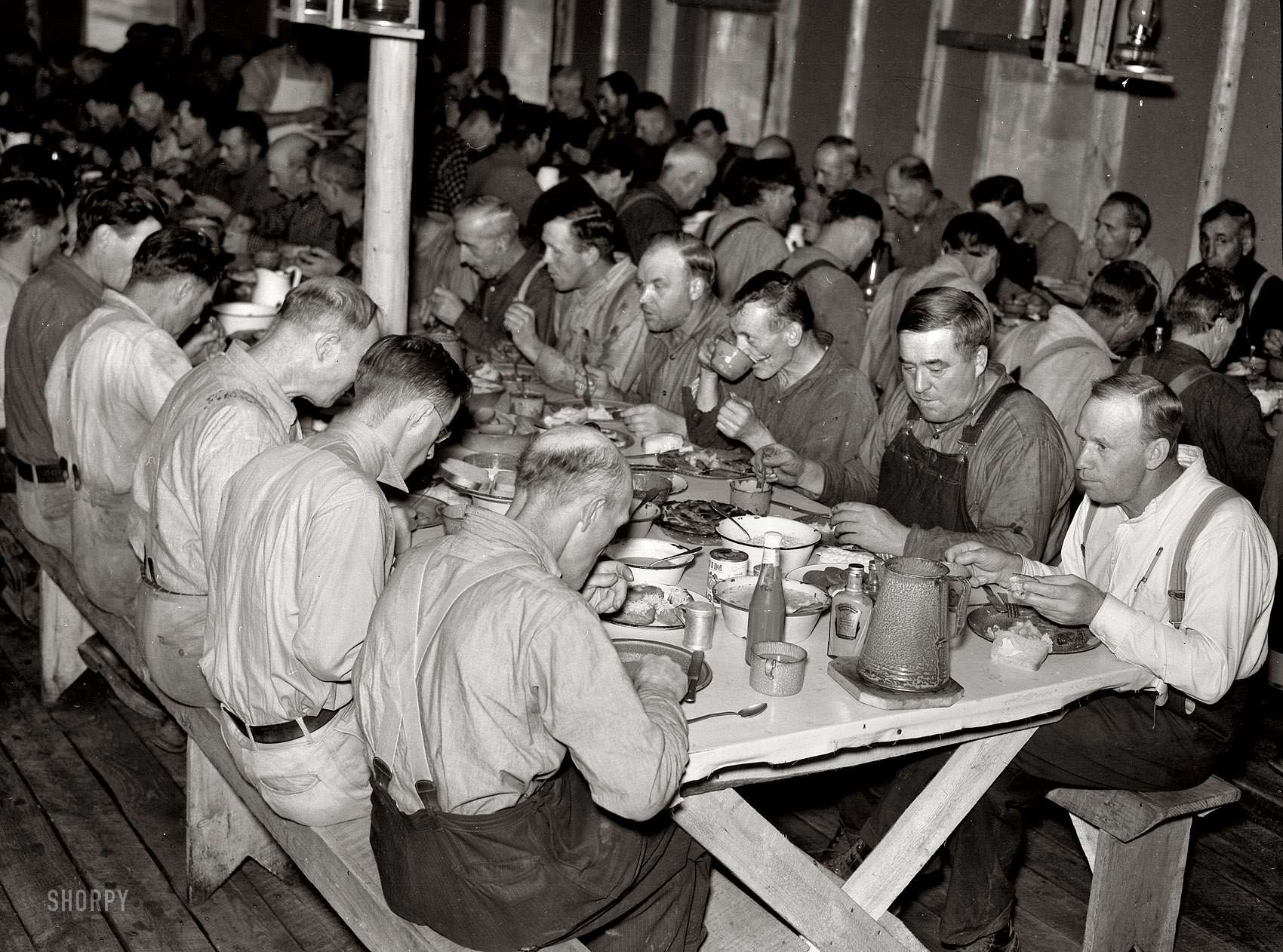 September 1937. "Lumberjacks at dinner. Camp near Effie, Minnesota." Nitrate negative by Russell Lee for the Resettlement Administration. View full size.