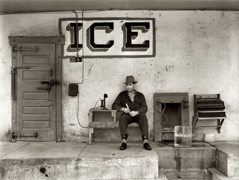 February 1939. "Ice for sale. Harlingen, Texas." View full size. Medium format negative by Russell Lee for the Farm Security Administration. Here we have a very concise study in what you need for an ice business: Telephone, cash register, tongs, ice pick and a big block of you-know-what. Not to mention plenty of twine.