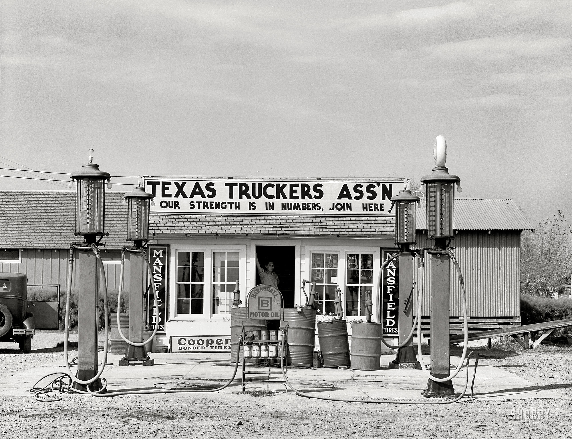 February 1939. "Gas station. Edcouch, Texas." One-stop shopping for petroleum and petunias. Medium-format nitrate negative by Russell Lee. View full size.