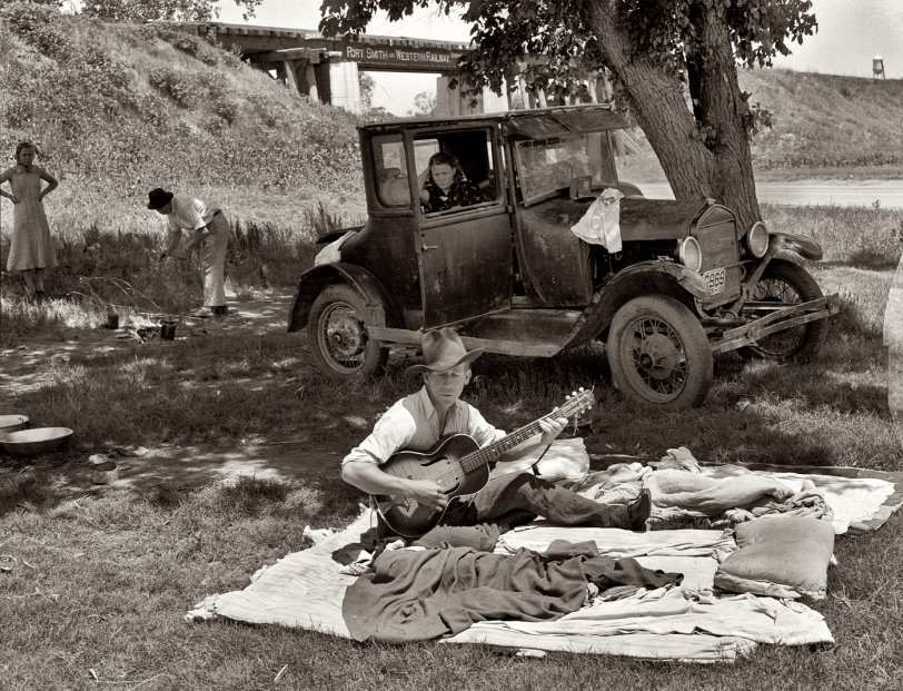 June 1939. Lincoln County, Oklahoma. Camp of migrant workers near Prague. View full size. Medium-format negative by Russell Lee for the FSA.
