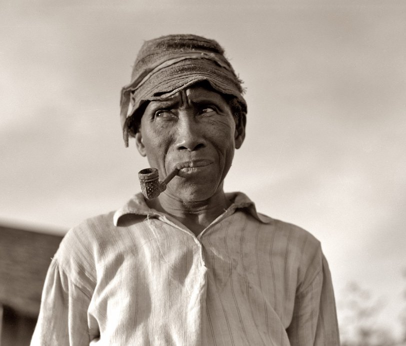 June 1937. "Old Negro. He hoes, picks cotton and is full of good humor. Aldridge Plantation, Mississippi." View full size. Photo and caption by Dorothea Lange.
