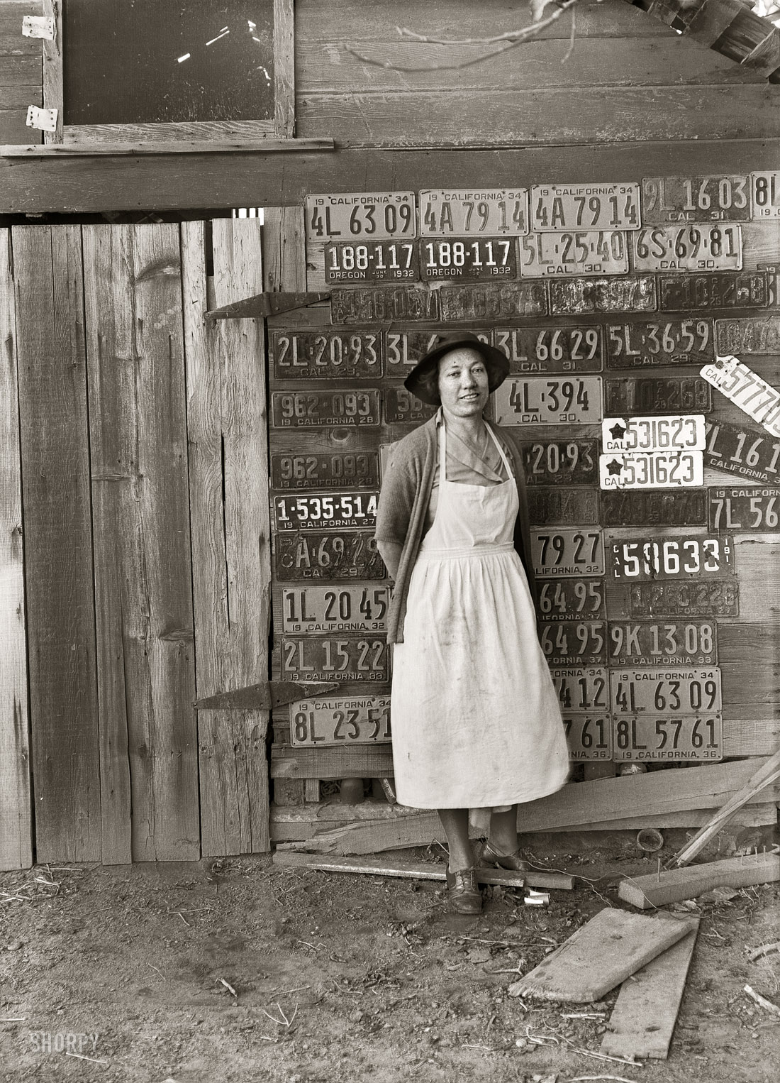 November 1938. "Farm woman beside her barn door. Tulare County, California. No more horseshoes!" Medium-format nitrate negative by Dorothea Lange for the Farm Security Administration. View full size.  