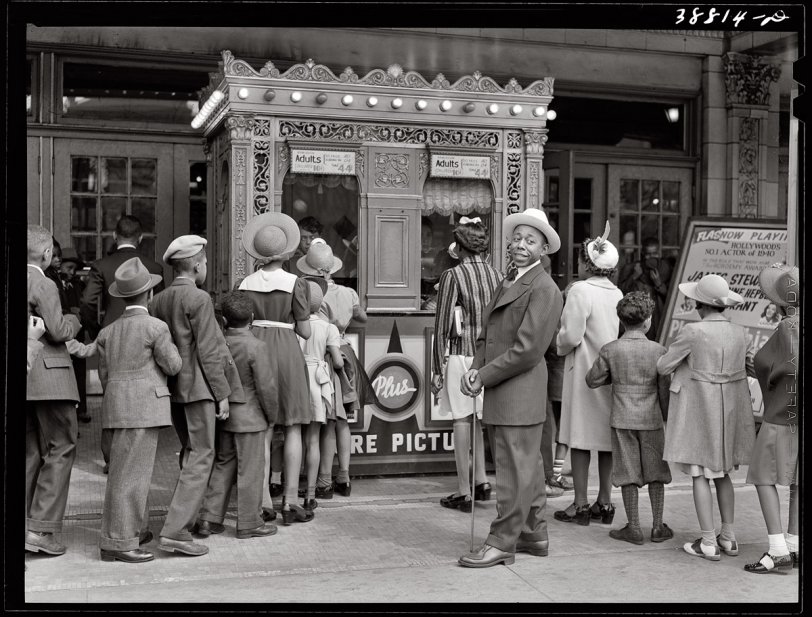 Chicago moviegoers waiting to see "The Philadelphia Story" starring Stewart, Grant and Hepburn. April 1941.  View full size. Photograph by Russell Lee.
