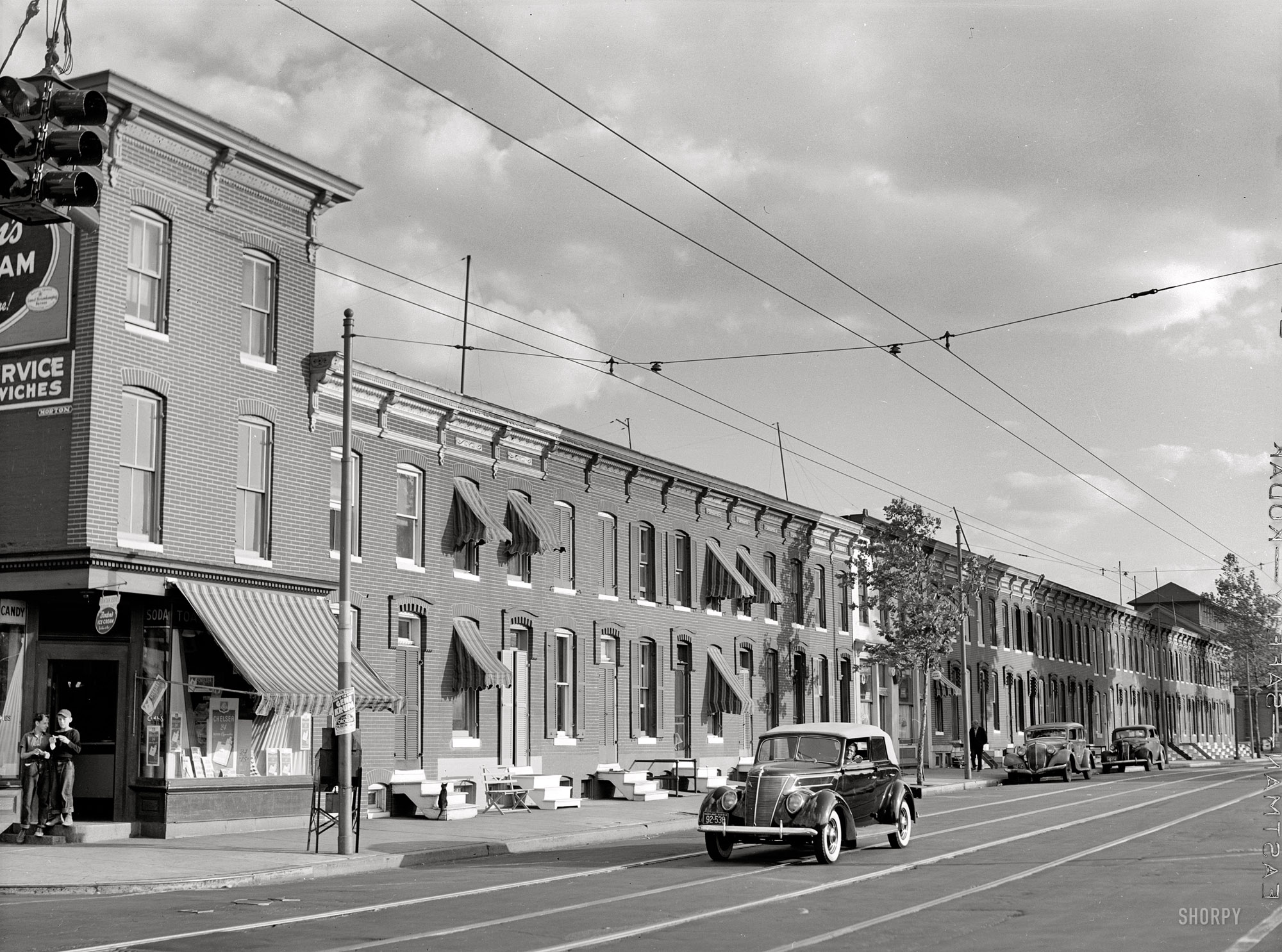 "Row houses, Baltimore, June 1940." Medium format safety negative by Jack Delano for the Farm Security Administration. View full size.