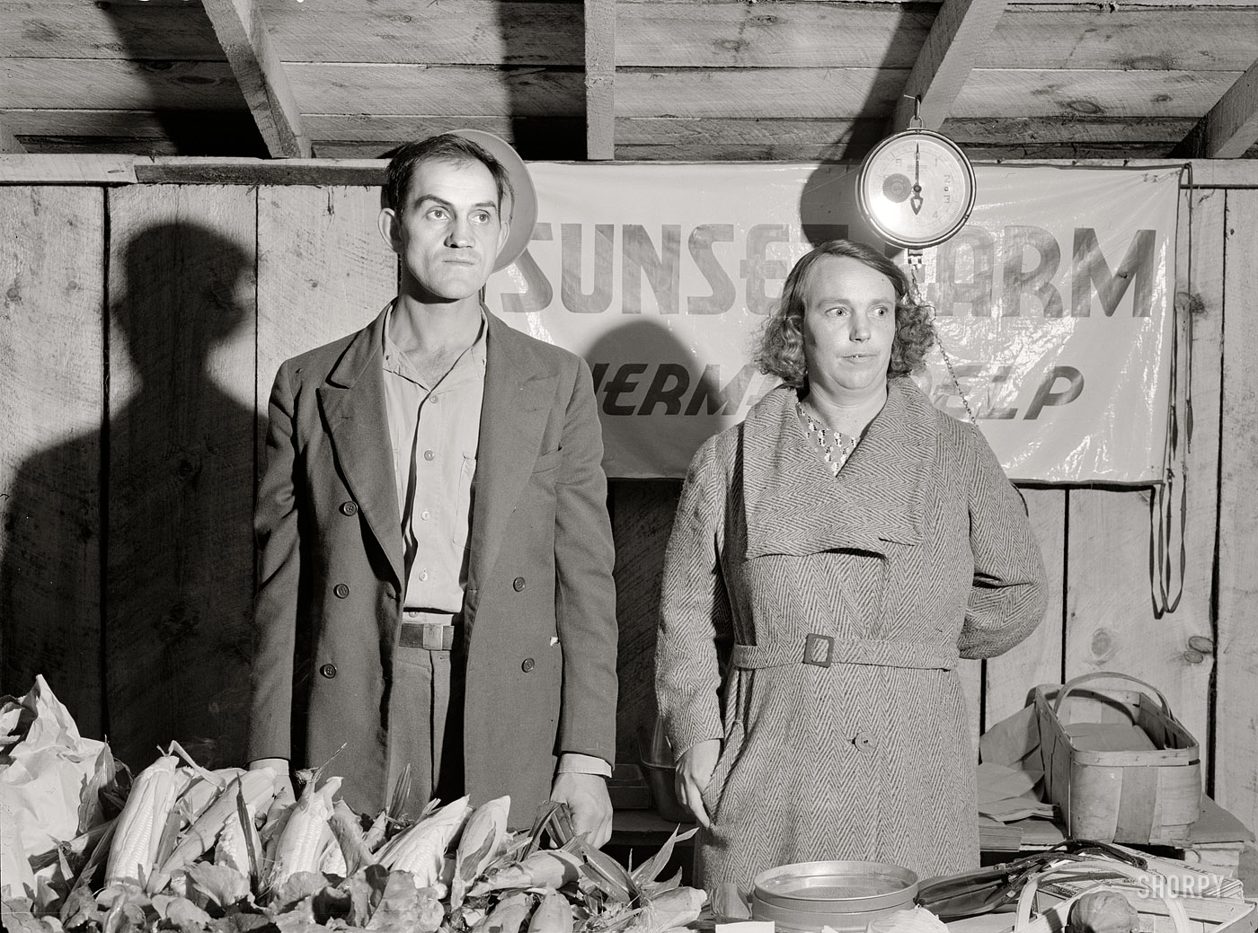 August 1940. Du Bois, Pennsylvania. "Farmer and wife at the Tri-County Farmers Co-op Market." Medium-format safety negative by Jack Delano. View full size.