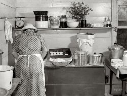 September 1939. Granville County, North Carolina. "One of the Wilkins family making biscuits for dinner on cornshucking day at Mrs. Fred Wilkins' home near Tallyho." Medium format negative by Marion Post Wolcott. View full size.
