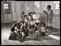 February 1941. Singing and music for agricultural workers' children in a new day nursery for the Okeechobee migratory labor camp at Belle Glade, Florida. Medium-format safety negative by Marion Post Wolcott. View full size.