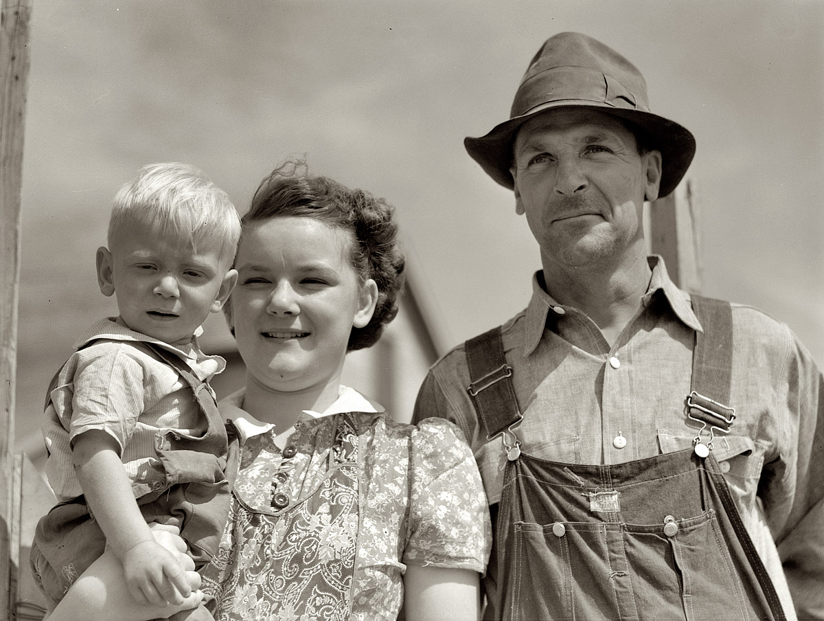 August 1941. Laredo, Montana. "Farm Security Administration borrower and 2 of his children." View full size. Medium format negative by Marion Post Wolcott.