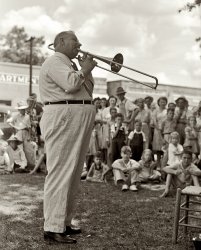 August 1941. "Local band leader plays 'An Old Southern Melody' and everybody cheered." Coffee County, Alabama. View full size. Medium format safety negative by John Collier for the Farm Security Administration.