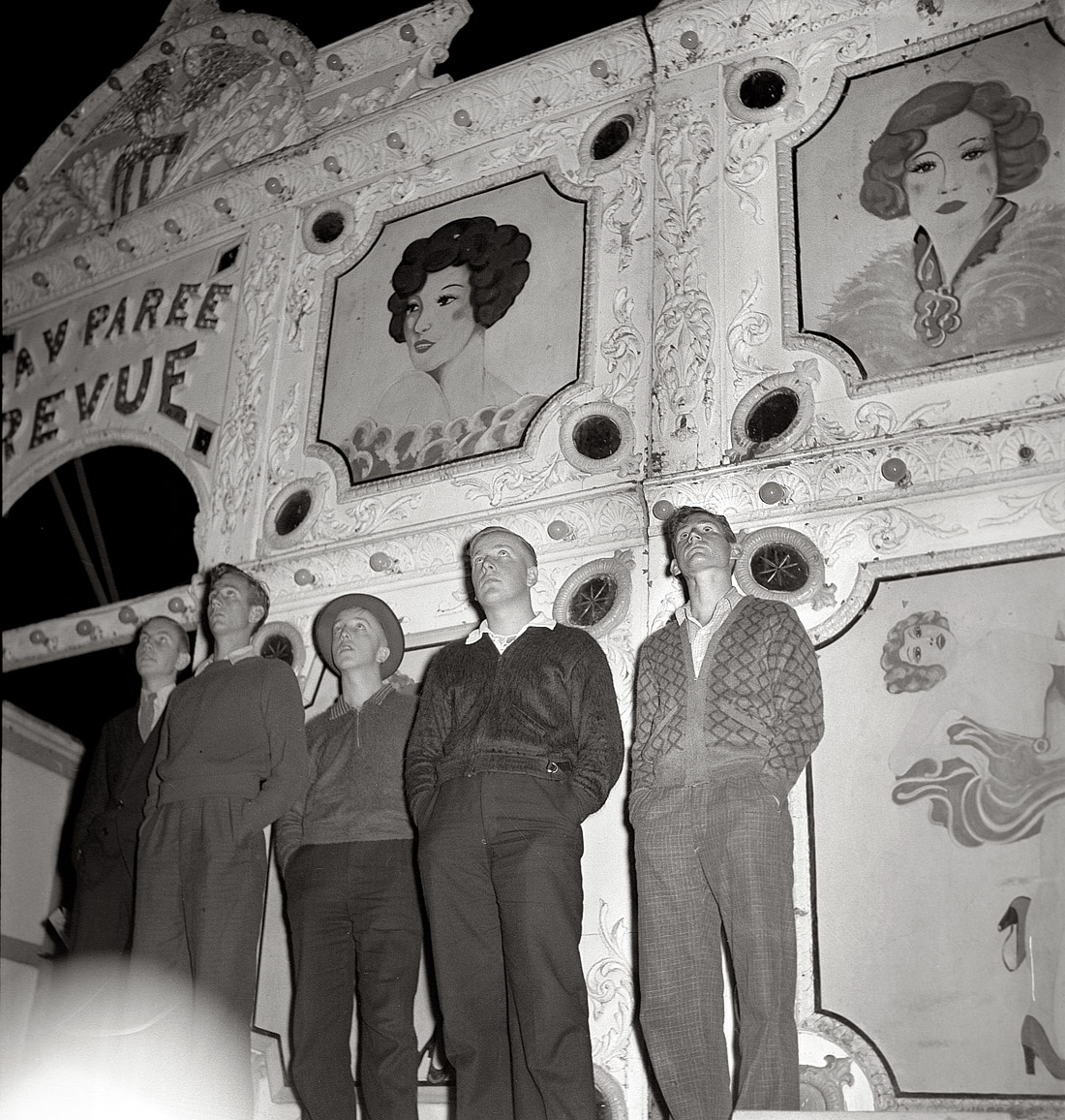 September 1938. Granville, West Virginia. "Coal miner's sons watch aerial trapeze artists at outdoor carnival. Large event and only outdoor amusement during the year." Nitrate negative by Marion Post Wolcott for the FSA. View full size.