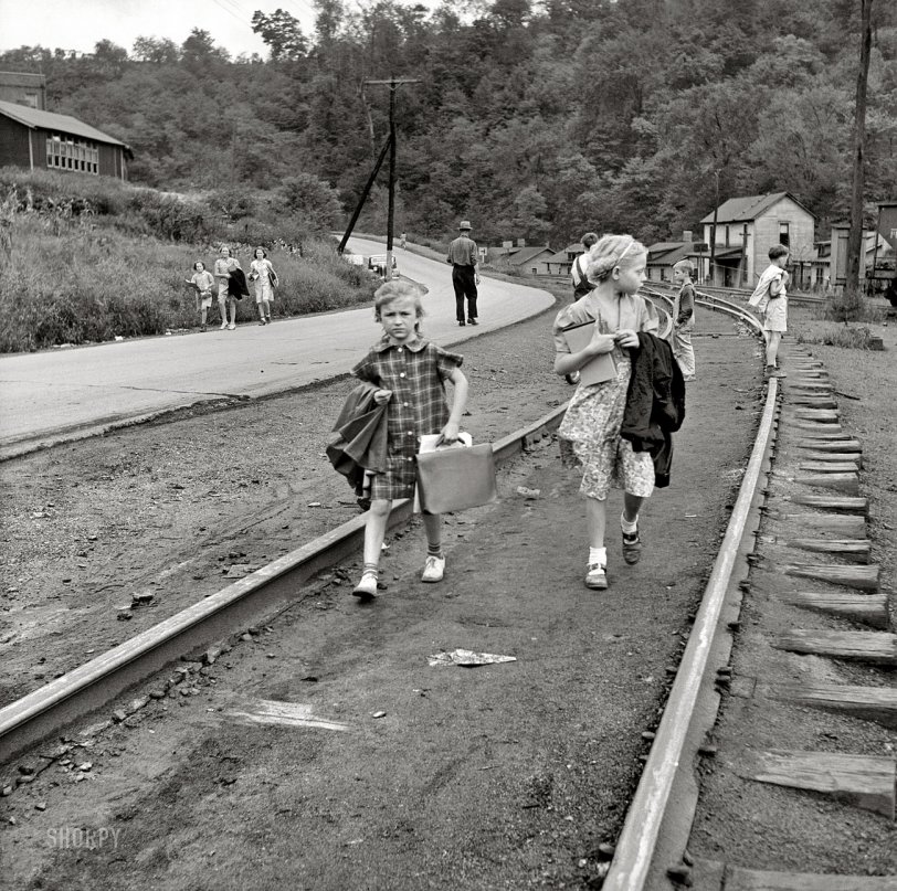 September 1938. Osage, West Virginia. "Mining town. Coming home from school." Medium format nitrate negative by Marion Post Wolcott. View full size.
