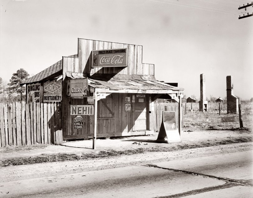 December 1935. "Coca-Cola shack in Alabama." Photograph by Walker Evans. Back in the 1930s  just about any building or barn was like a Web site -- you could rent out the blank spaces for banner ads (in this case for the circus in Montgomery). View full size.
