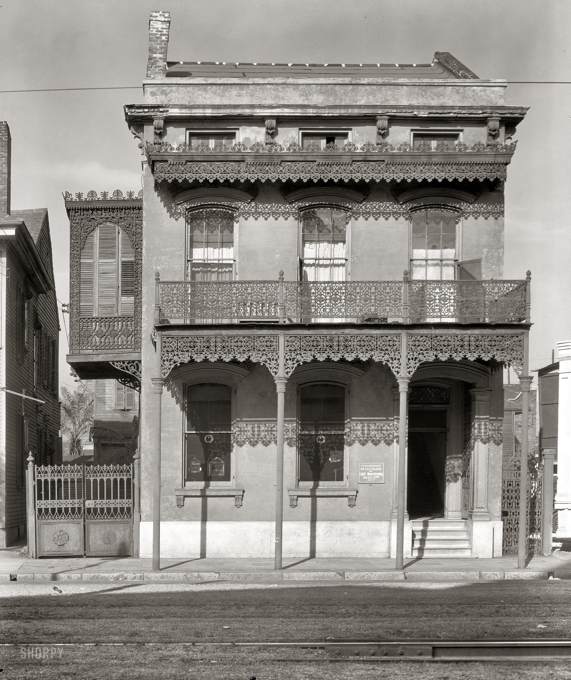 January 1936. "New Orleans architecture. Cast-iron grillwork house near Lee Circle on Saint Charles Avenue." Large-format nitrate negative by Walker Evans for the Farm Security Administration. View full size.  