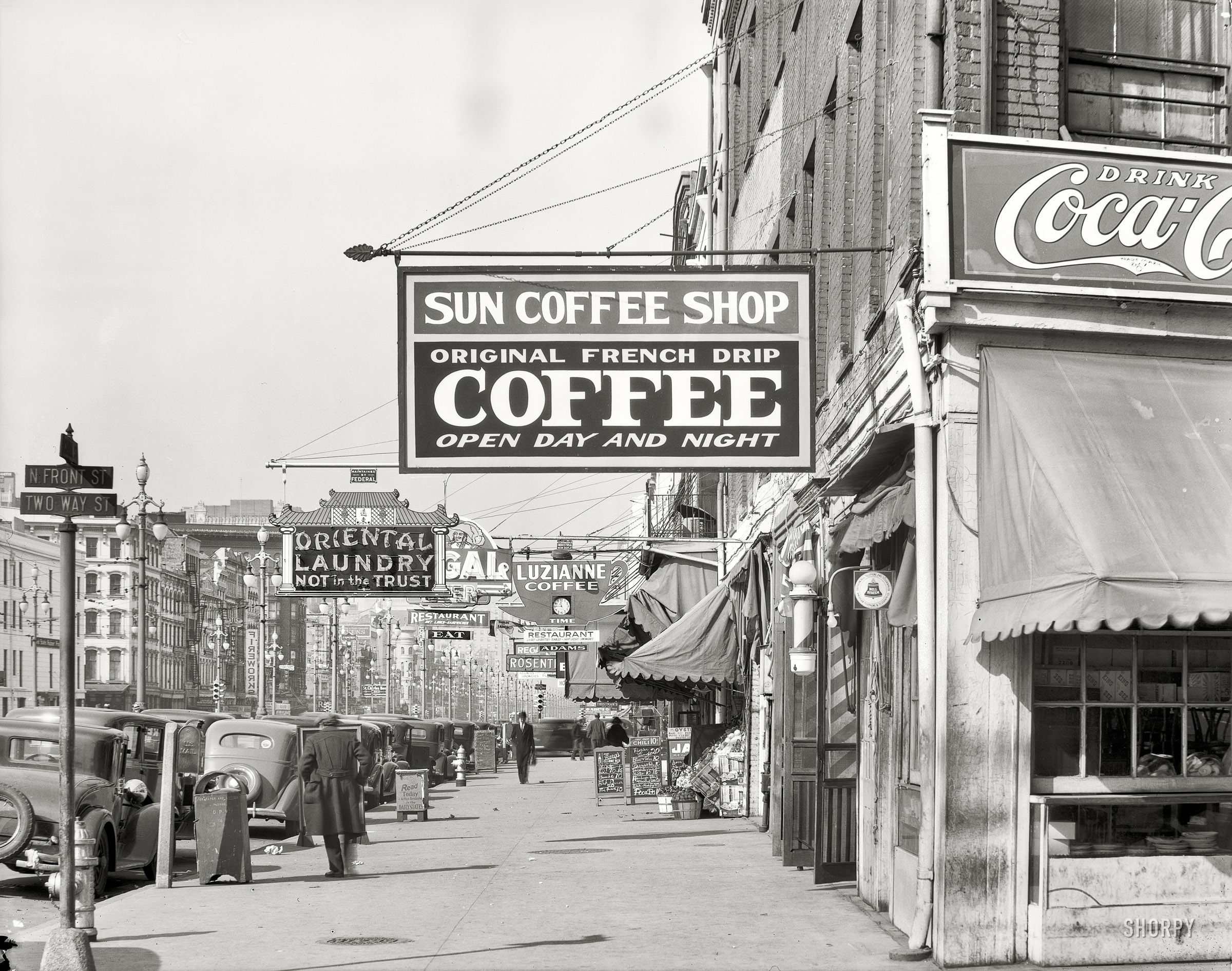 December 1935. "New Orleans, downtown street." North Front at Canal. Nitrate negative by Walker Evans for the Farm Security Administration. View full size. 