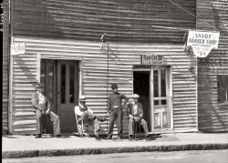 March 1936. Vicksburg, Mississippi. "Vicksburg Negroes and shop front." A close-up of the New Deal barbershop seen in the previous post. Nitrate negative by Walker Evans for the Resettlement Administration. View full size. 