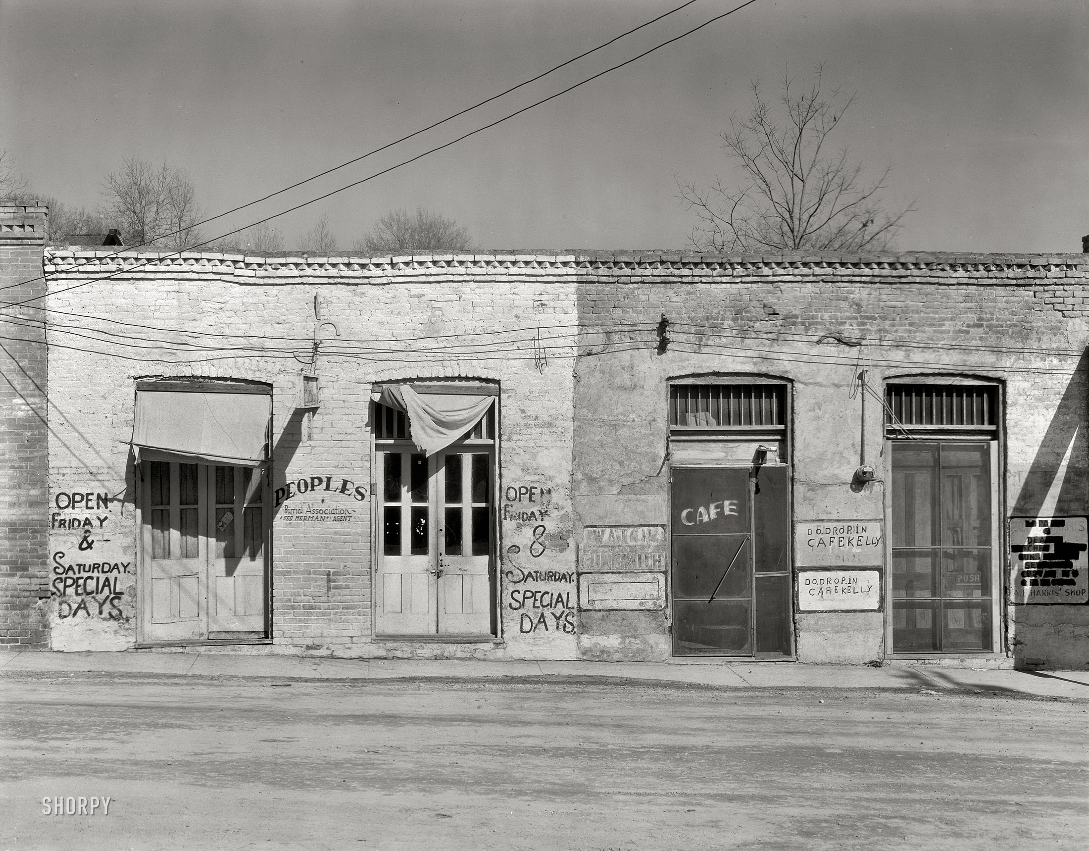 March 1936. Edwards, Mississippi. "Main street storefronts." Large-format nitrate negative by Walker Evans for the Farm Security Administration. View full size. 