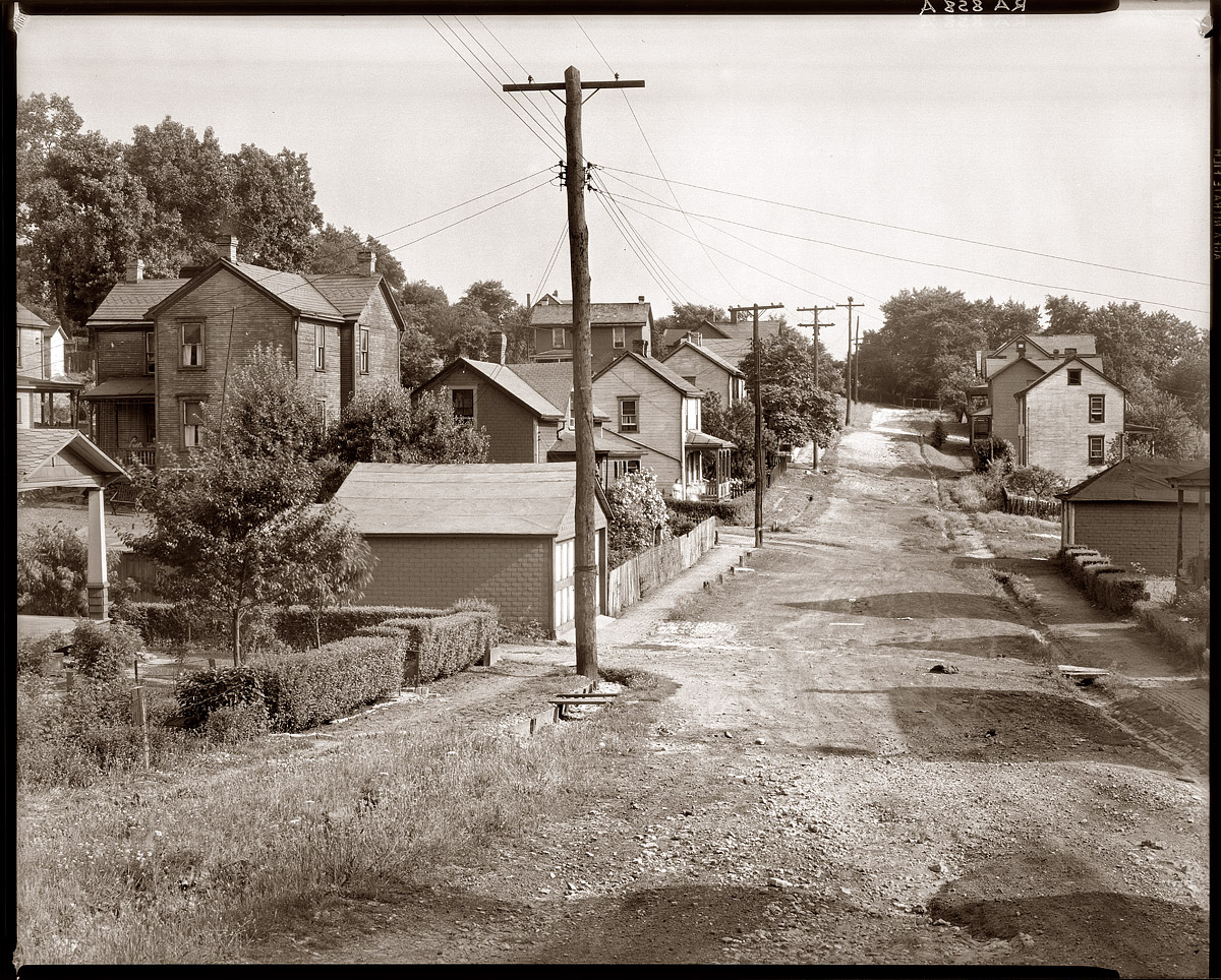 July 1935. "Back street. Mount Pleasant, Pennsylvania. Westmoreland County."  View full size. Photograph by Walker Evans, Farm Security Administration.