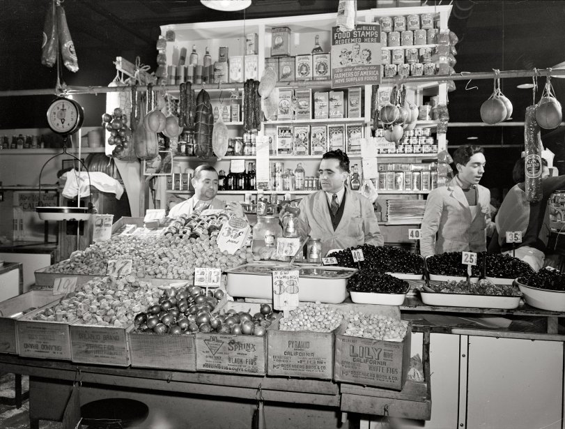 January 1943. "New York. Italian grocer in the First Avenue market at Tenth Street." Medium-format safety negative by Marjory Collins. View full size.

