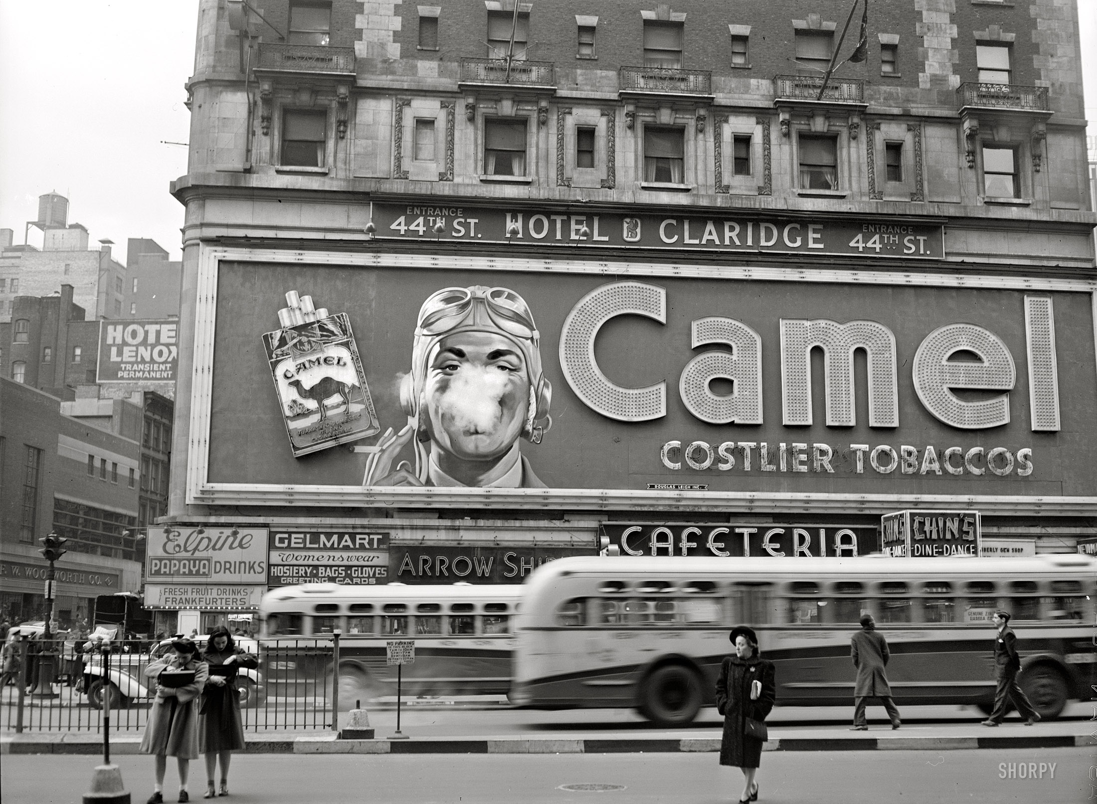 February 1943. "New York. Camel cigarette advertisement at Times Square." Photograph by John Vachon for the Office of War Information. View full size.