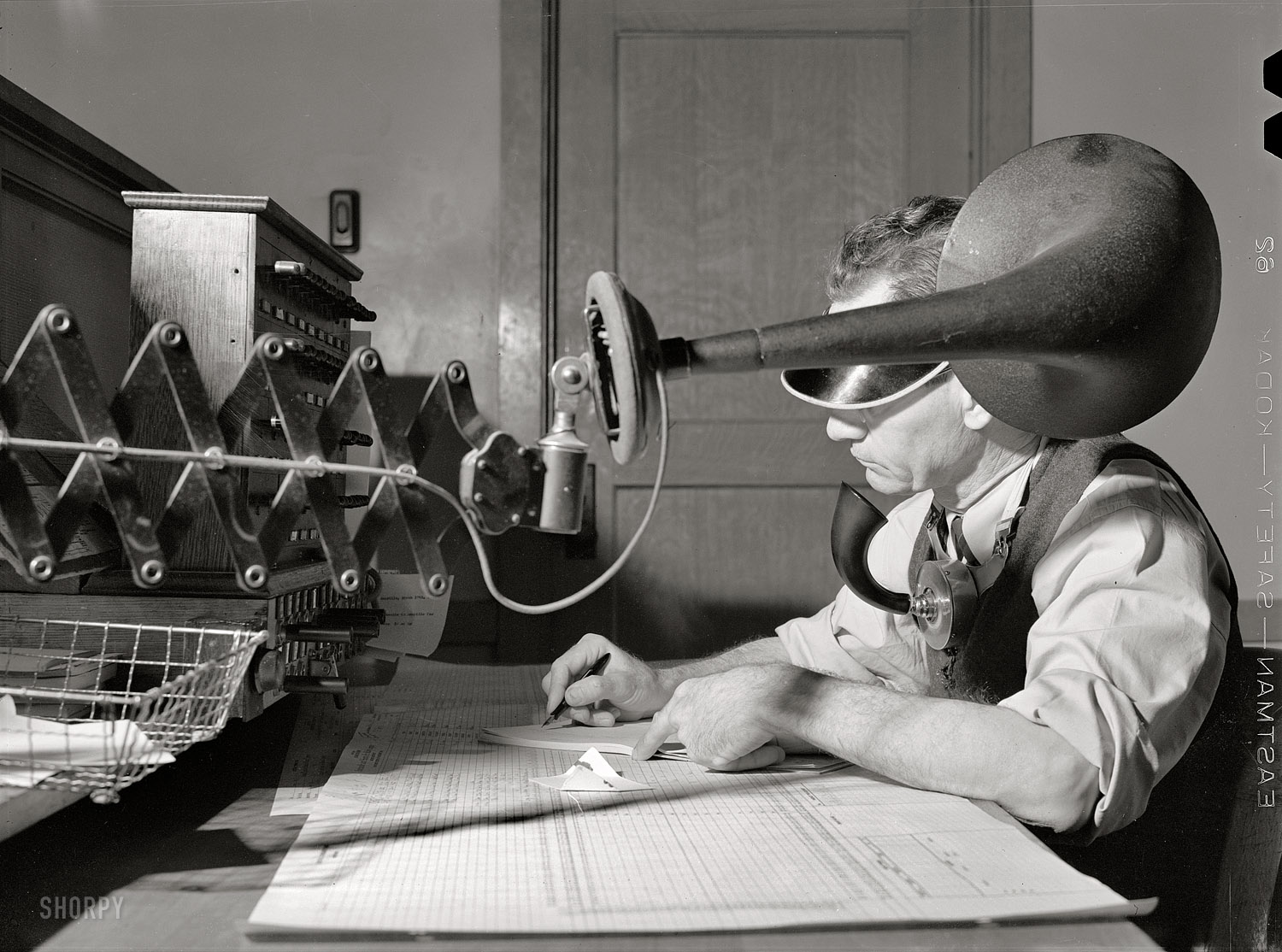 March 1943. "Amarillo, Texas. Atchison, Topeka and Santa Fe rail dispatcher in the general office." Medium-format negative by Jack Delano. View full size.