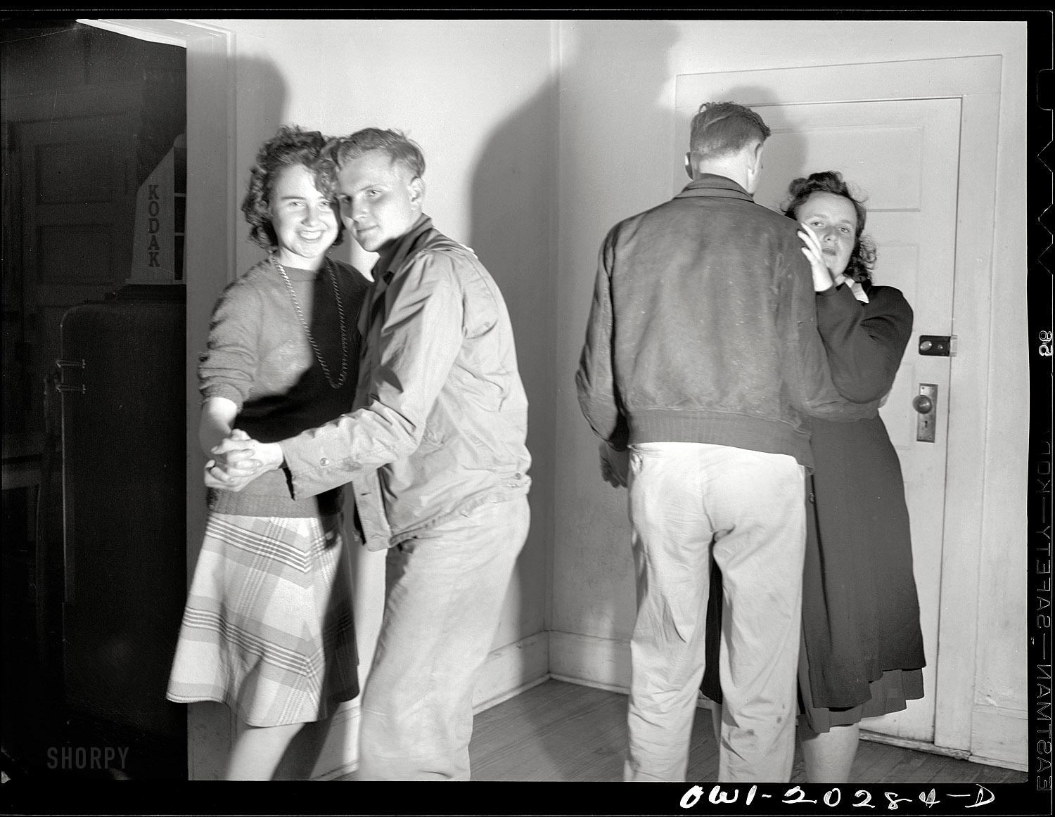 March 1943. "Farm boys and girls dancing to a jukebox at Mary's Place on U.S. Highway 29 near Charlottesville, Virginia." Medium format acetate negative by John Vachon for the Office of War Information. View full size.