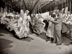 July 1943. Scene in a wholesale meat market shot for the Office of War Information film "Black Marketing." View full size. Photo by Roger Smith.