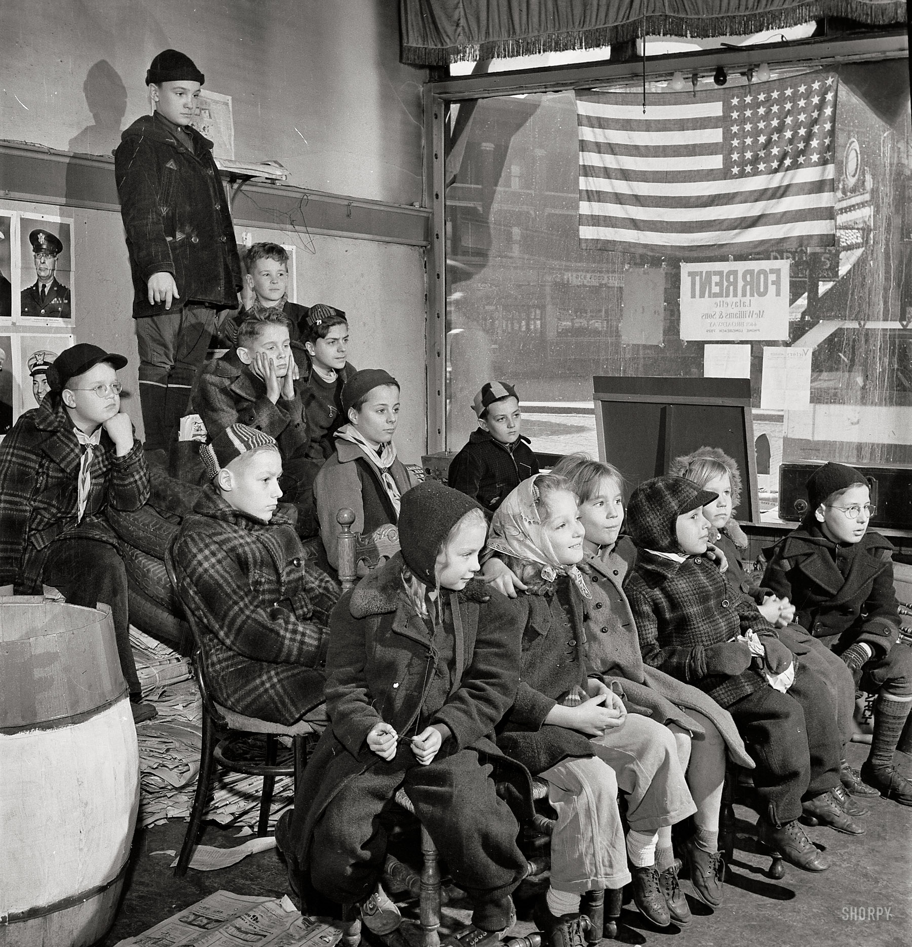 November 1942. "Chicago (north), Illinois. Children assembled in Office of Civilian Defense headquarters for a pep talk on the need of bringing in more scrap." Medium-format nitrate negative by Jack Delano. View full size.