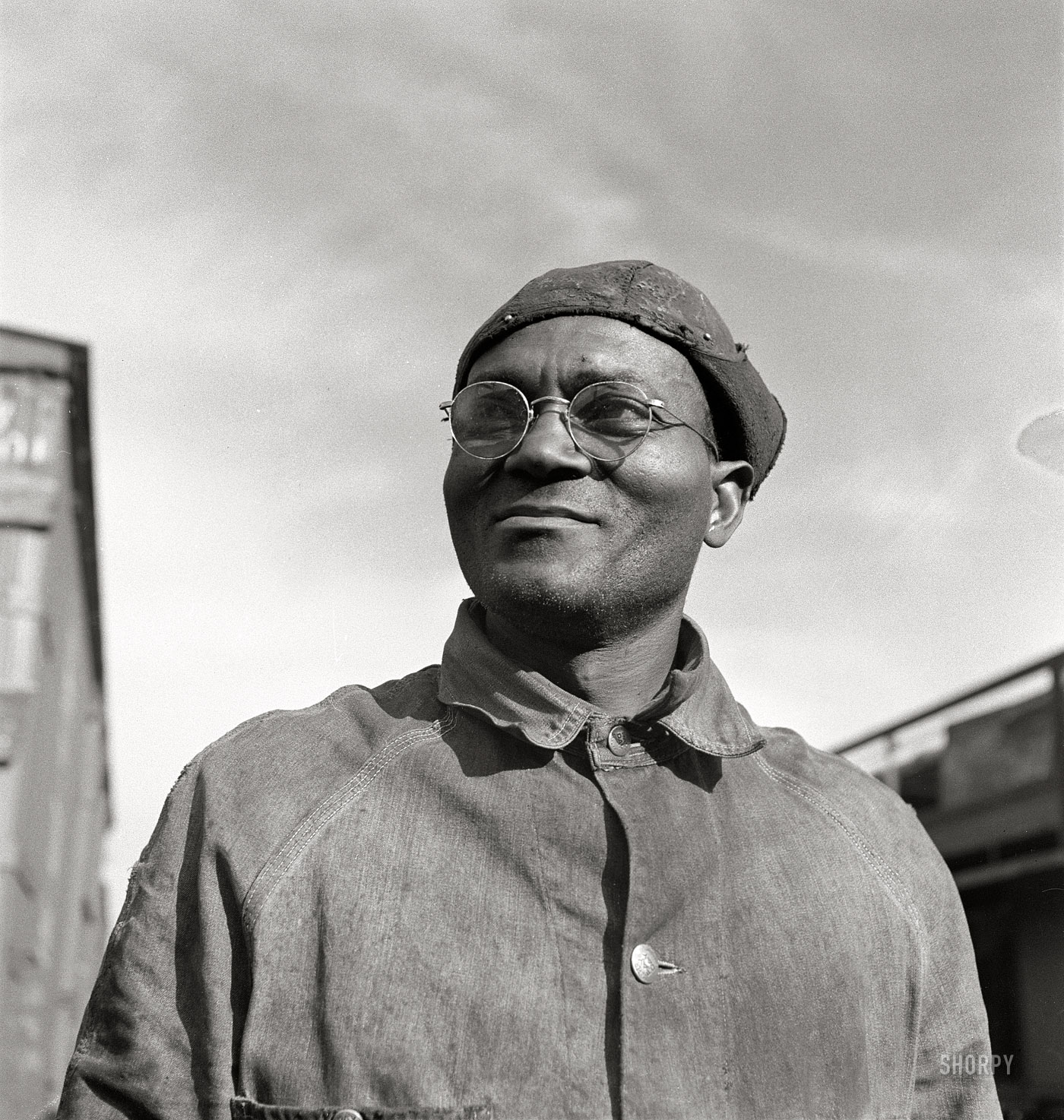 March 1943. "Topeka, Kansas. Robert L. Hill, steel car repairer and rivet driver, at the car shops of the Atchison, Topeka and Santa Fe Railroad." Medium-format nitrate negative by Jack Delano, Office of War Information. View full size.