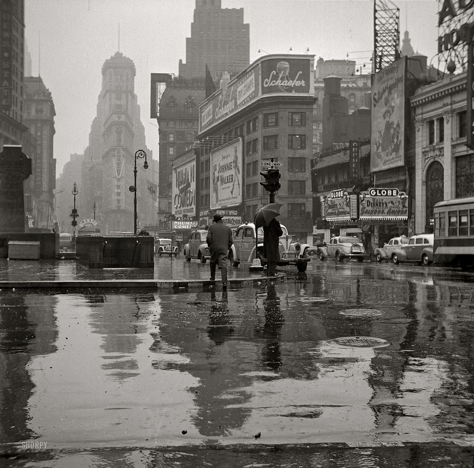 New York, March 1943. "Times Square on a rainy day." Medium-format nitrate negative by John Vachon for the Office of War Information. View full size.