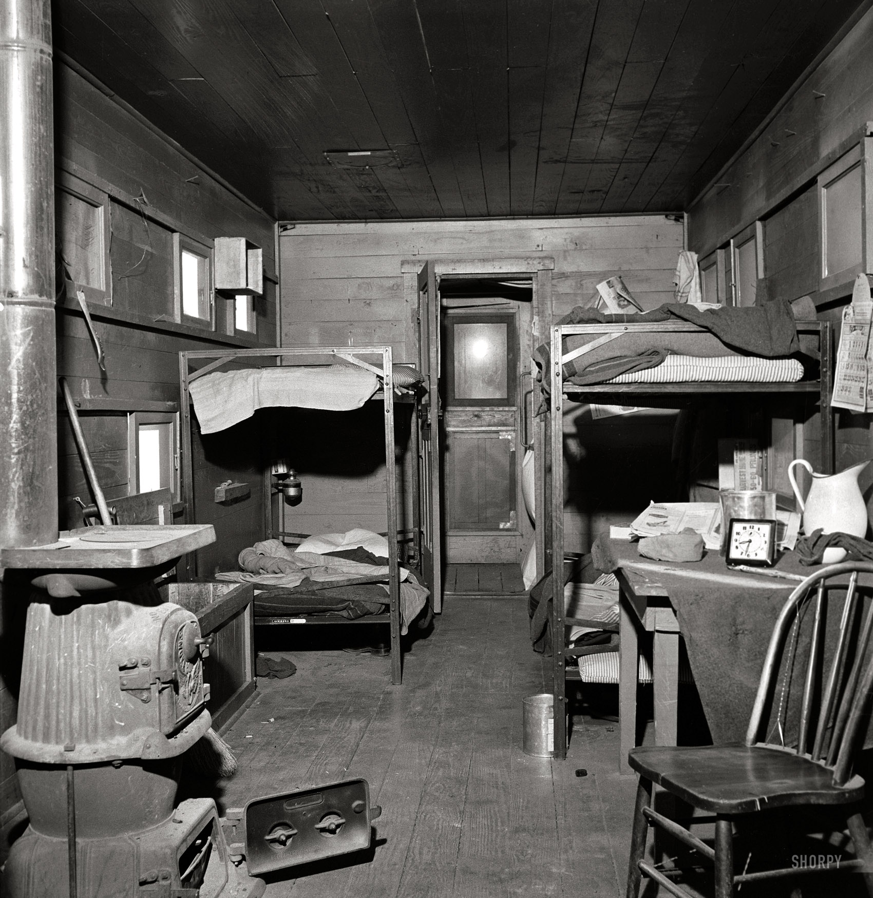 March 1943. "Iden, New Mexico. One of the bunk cars for section workers of a train on the Atchison, Topeka and Santa Fe Railroad between Clovis and Vaughn." Medium-format nitrate negative by Jack Delano. View full size.