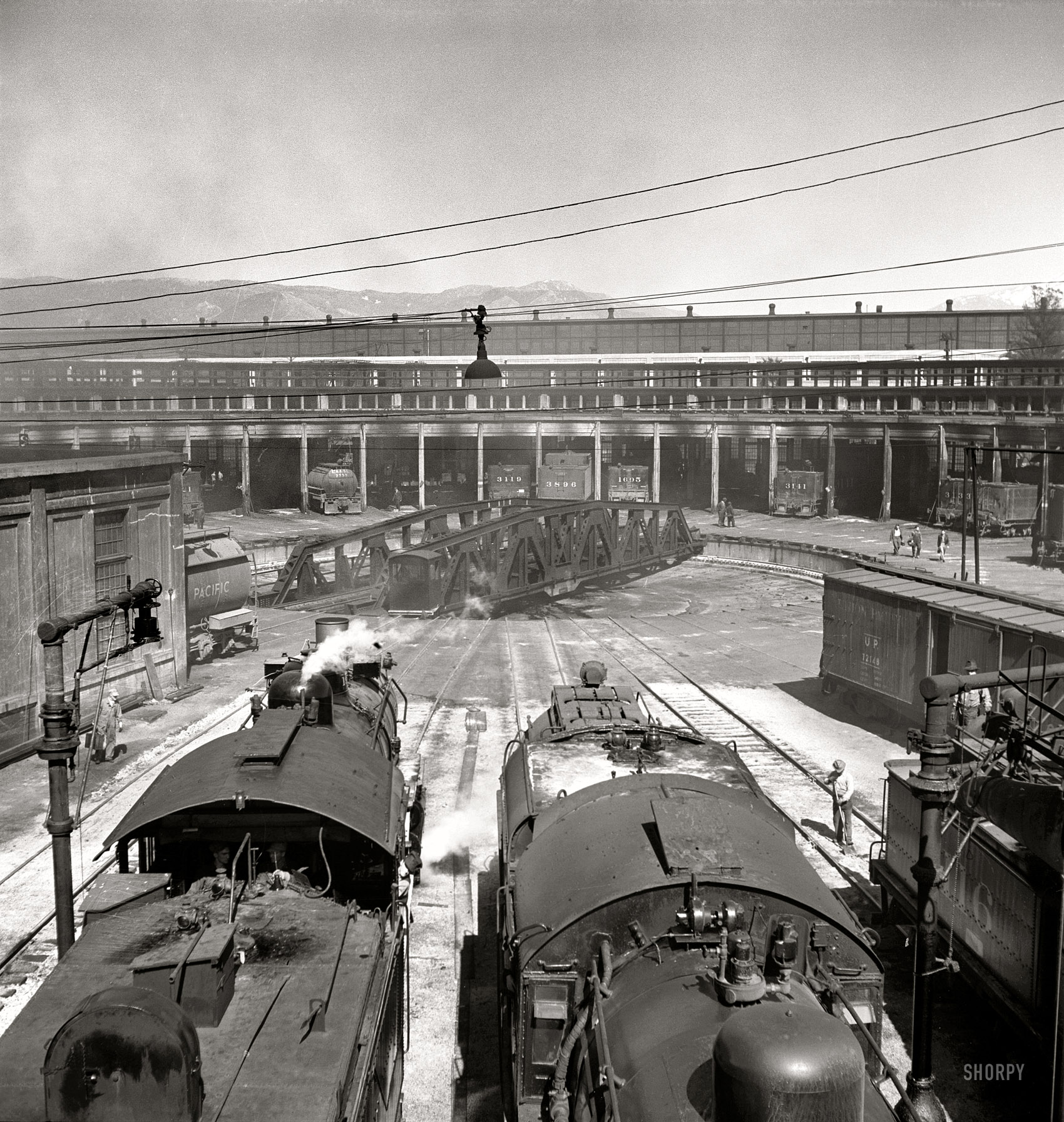March 1943. "San Bernardino, California. Engines at the roundhouse." Nitrate negative by Jack Delano for the Office of War Information. View full size.
