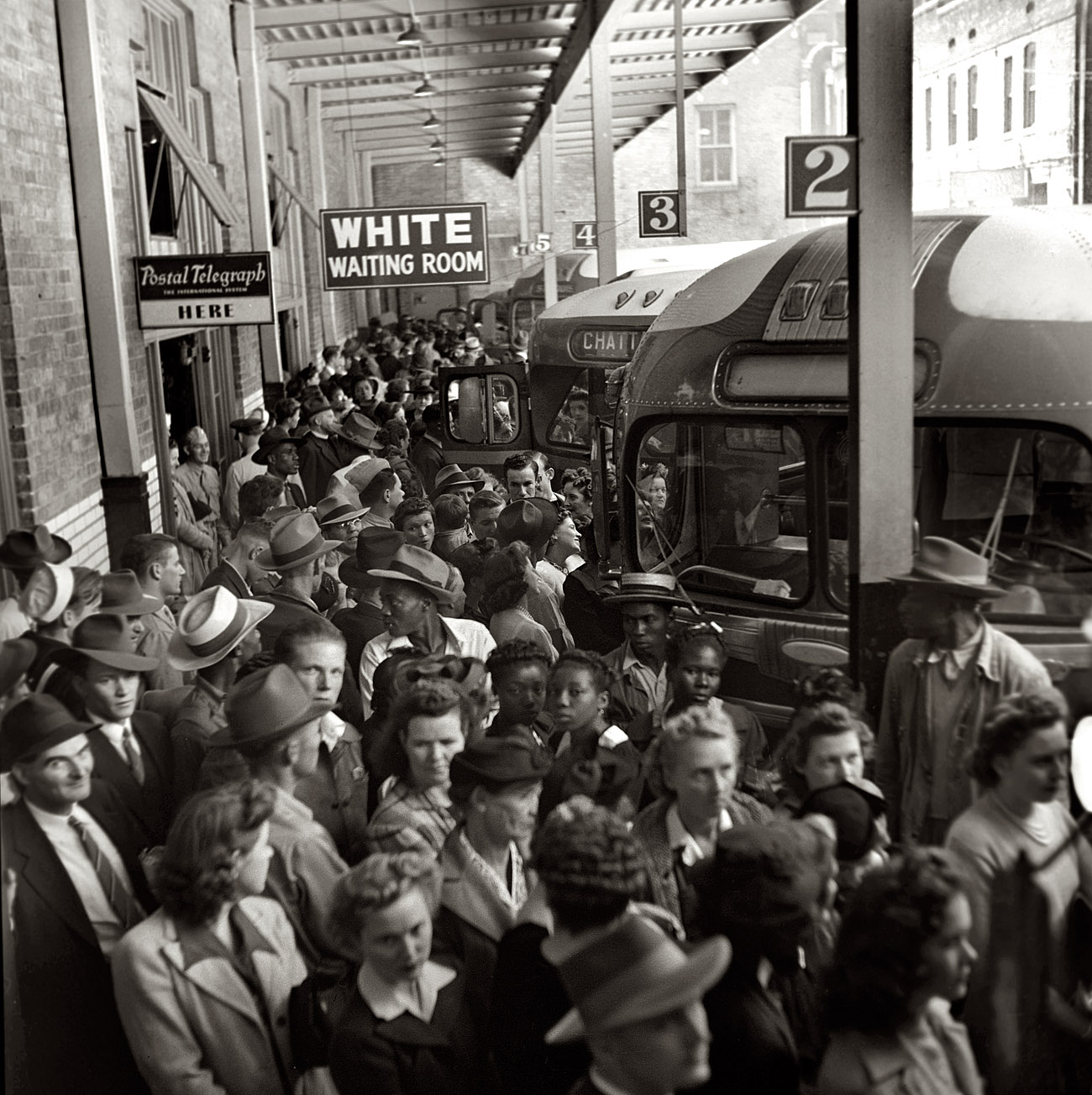September 1943. "Greyhound bus trip from Louisville, Kentucky, to Memphis, Tennessee. Waiting for the bus at the Memphis terminal." View full size. Medium-format negative by Esther Bubley for the Office of War Information.