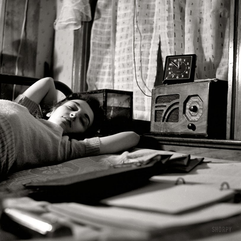 January 1943. Washington, D.C., war workers at home. "A radio is company for this girl in her boardinghouse room." Medium-format nitrate negative by Esther Bubley for the Office of War Information. View full size.
