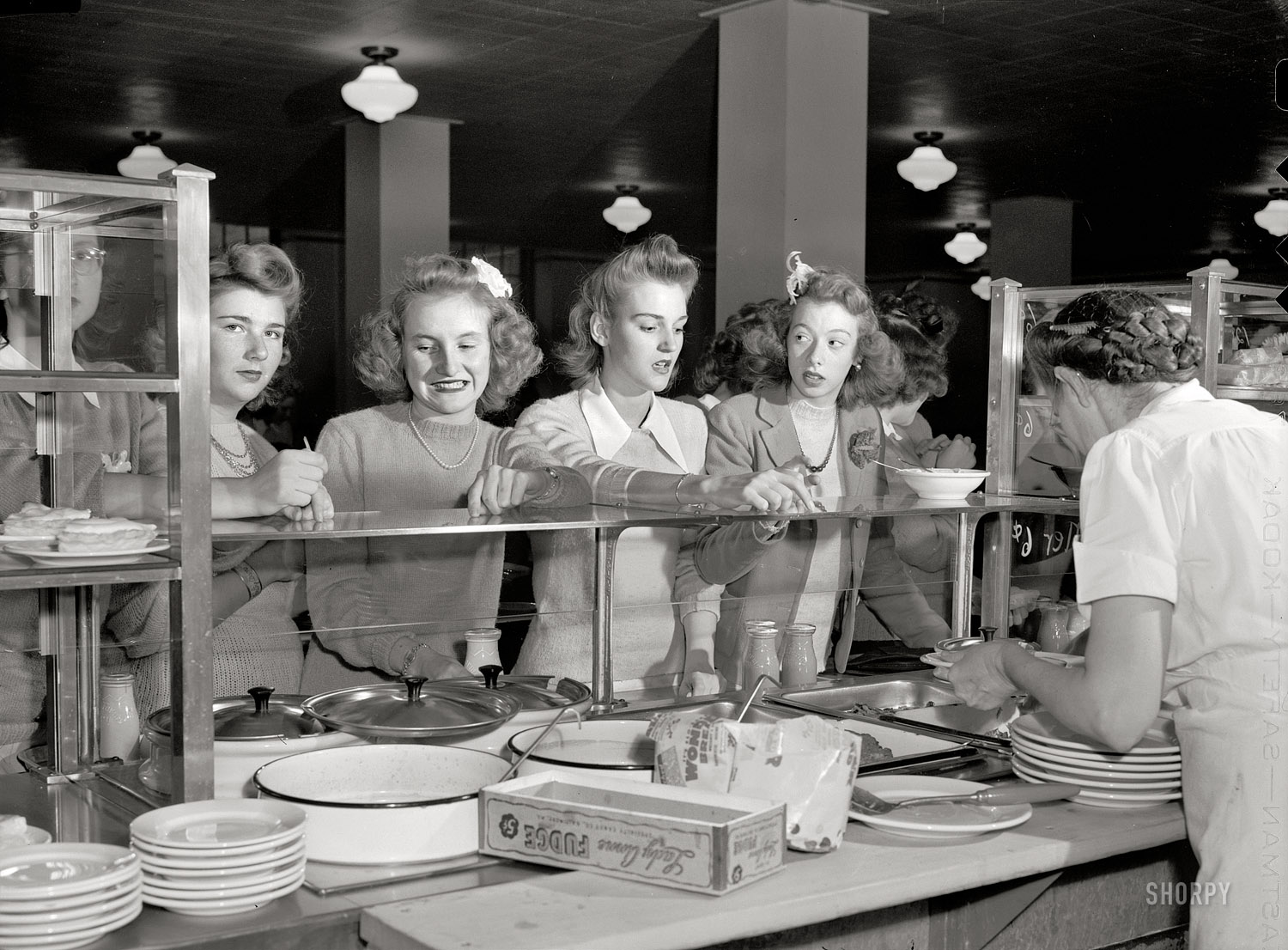 October 1943. Washington, D.C. "In the cafeteria at Woodrow Wilson High School." Photo by Esther Bubley, Office of War Information. View full size.