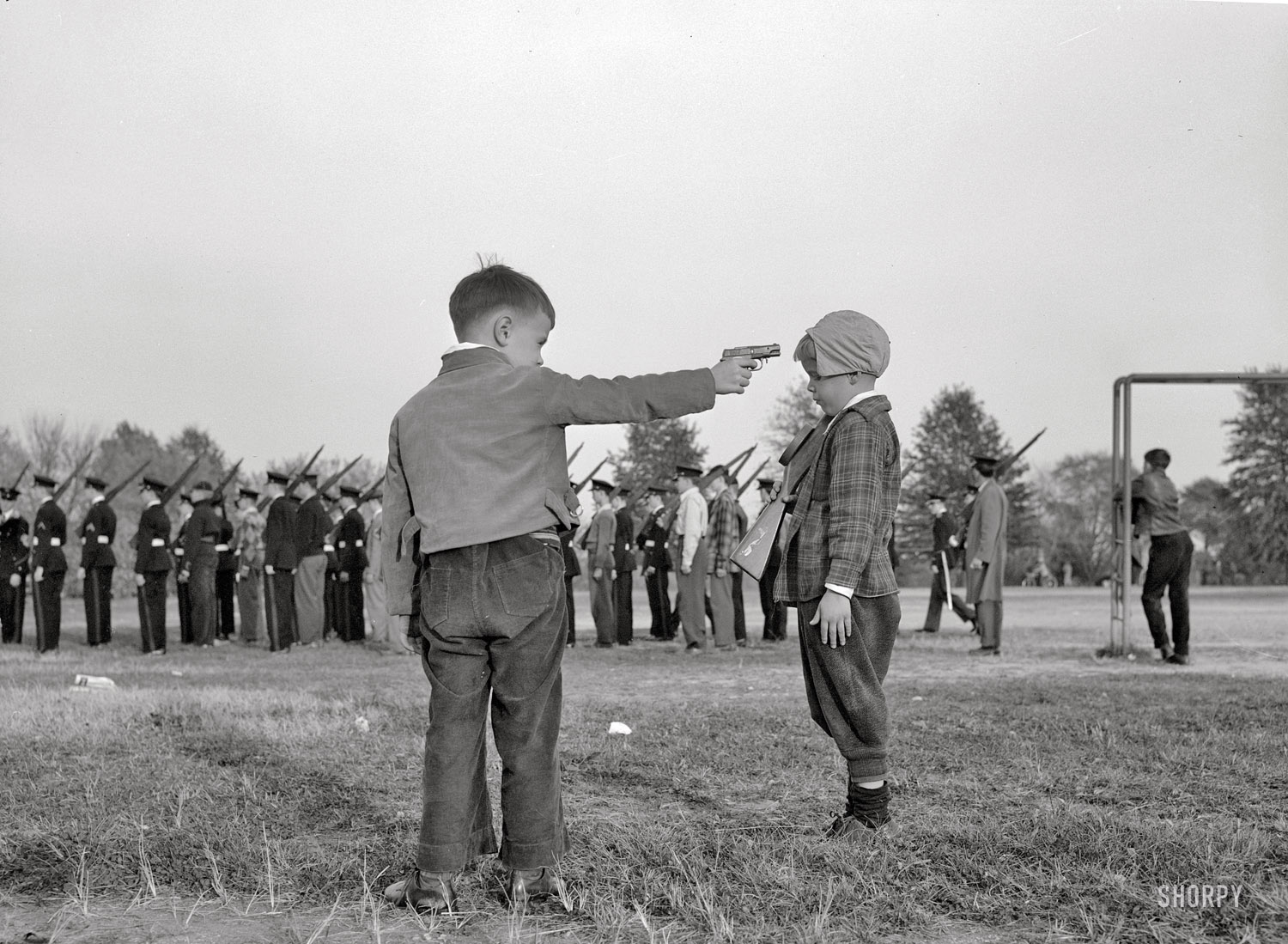 October 1943. Washington, D.C. "Boys watching the Woodrow Wilson high school cadets." Photo by Esther Bubley, Office of War Information. View full size.