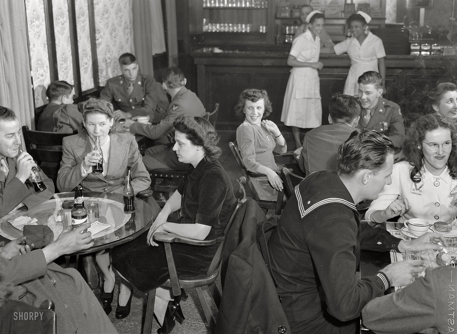 December 1943. Washington, D.C. "In the canteen for enlisted men at the United Nations Service Center on a Saturday night." Medium-format safety negative by Esther Bubley for the Office of War Information. View full size.