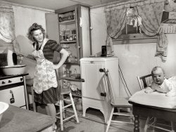 December 1943. "Lynn Massman, wife of a second class petty officer who is studying in Washington, does the washing every morning." View full size. Medium-format negative by Esther Bubley for the Office of War Information.