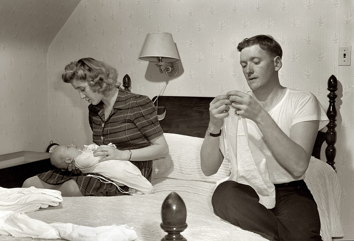 December 1943. "In the evening, Hugh Massman and his wife fold diapers. Joey's bureau drawer crib is moved to the side of their bed for the night." The Massmans were a young Navy family whose lives in Washington, D.C., were documented by Office of War Information photographer Esther Bubley. We're fortunate to have heard from their son Bascomb, whose comments have served as informative and entertaining annotations for these pictures. View full size.