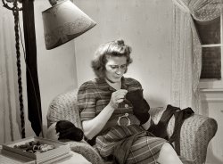 December 1943. "Lynn Massman, wife of a second class petty officer studying in Washington, D.C., darns socks in the afternoon while baby Joey has his nap." View full size. Medium-format safety negative by Esther Bubley for the OWI.